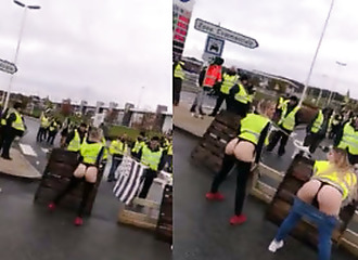 Yellow vests showing butts