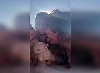 Sucked by 3 sluts on the beach
