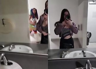 Interrupted while showing her breasts in a public toilet