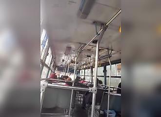 She masturbates and squirts at the bottom of a bus
